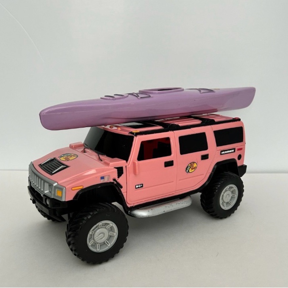 Pink and Purple Bass Pro Shop Hummer H2 SUV with Kayak